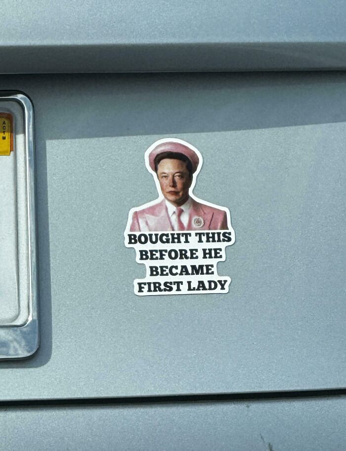 Sticker showing a man in pink suit with text about first lady