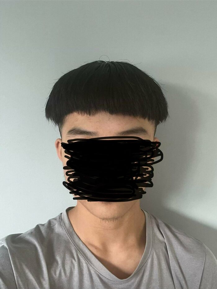 Man with a very short, round bowl cut, a prime example of a hair salon disaster.