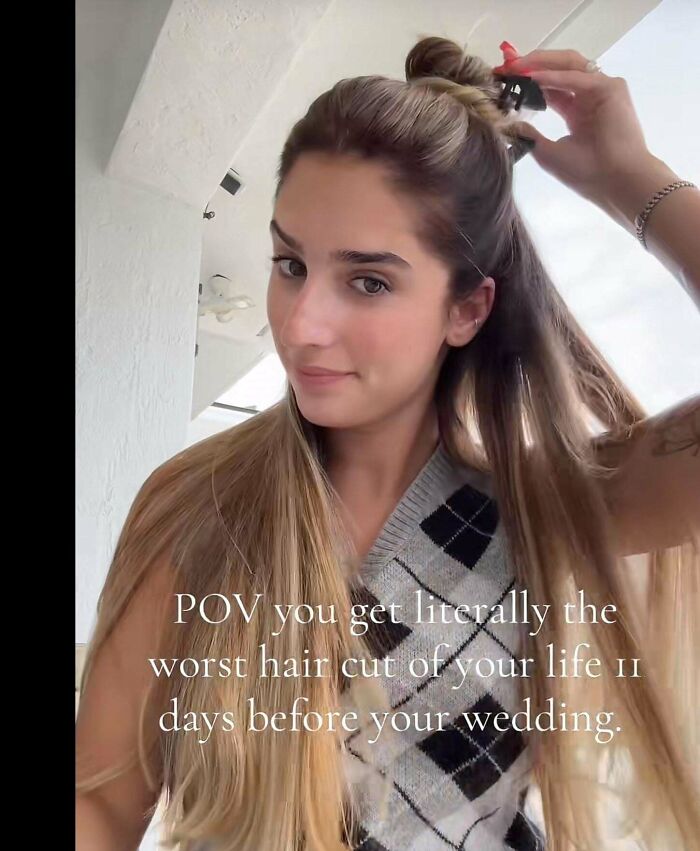 A woman looking dismayed at her long hair, illustrating a hair salon disaster before her wedding.