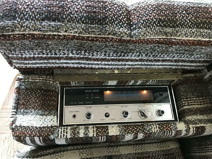 A built-in radio feature on a vintage couch, a unique detail for interior designer inspiration.