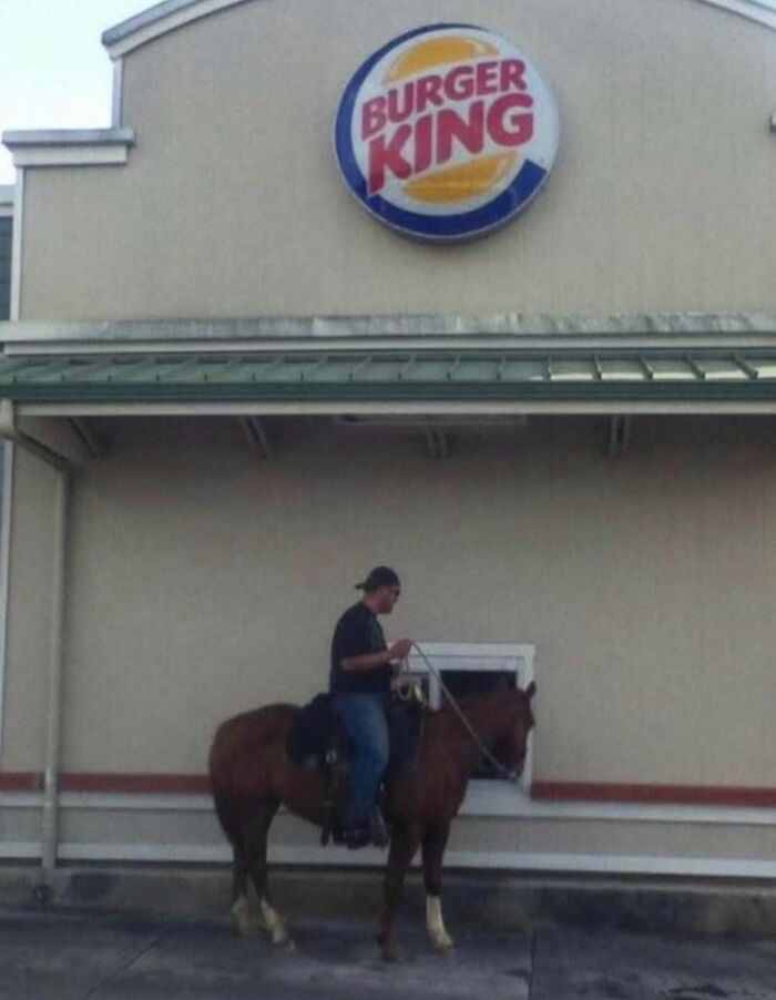 Man on horseback at a Burger King drive-thru illustrating unusual fast food drive-thru