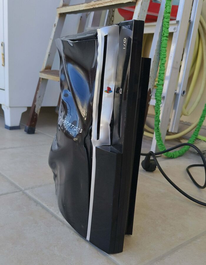 Melted PlayStation console, a clear example of electronics fails and damage.