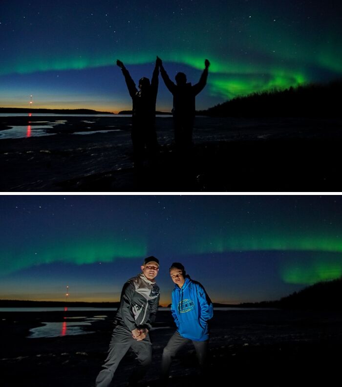 Two men silhouetted against the Northern Lights, capturing moments with amazing fathers.