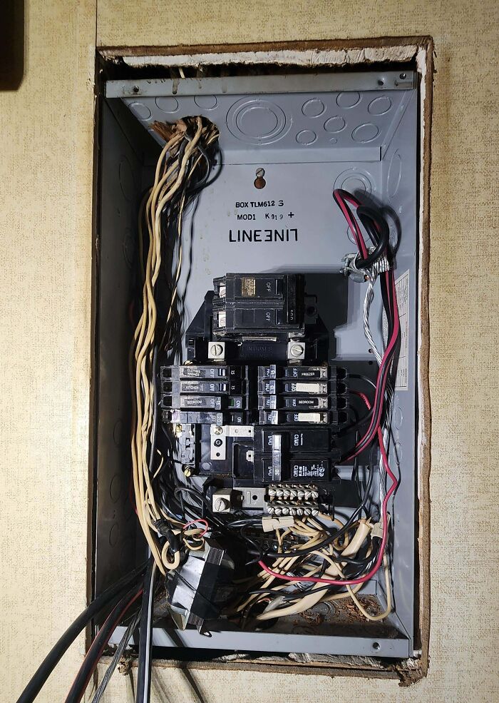 A messy electrical panel with exposed wires and circuits, demonstrating dangerous electronics fails.