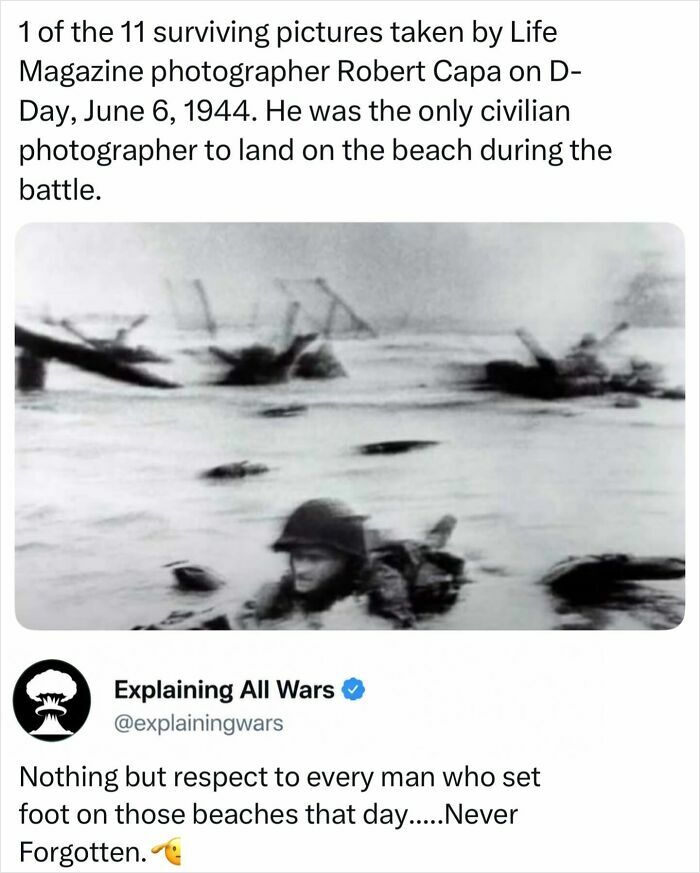 D-Day history photo by Robert Capa, showing a soldier wading ashore, explaining all wars.