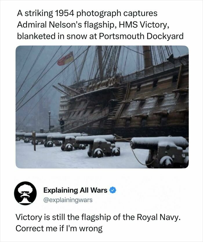 HMS Victory flagship blanketed in snow at Portsmouth Dockyard, an iconic image in naval history of wars.
