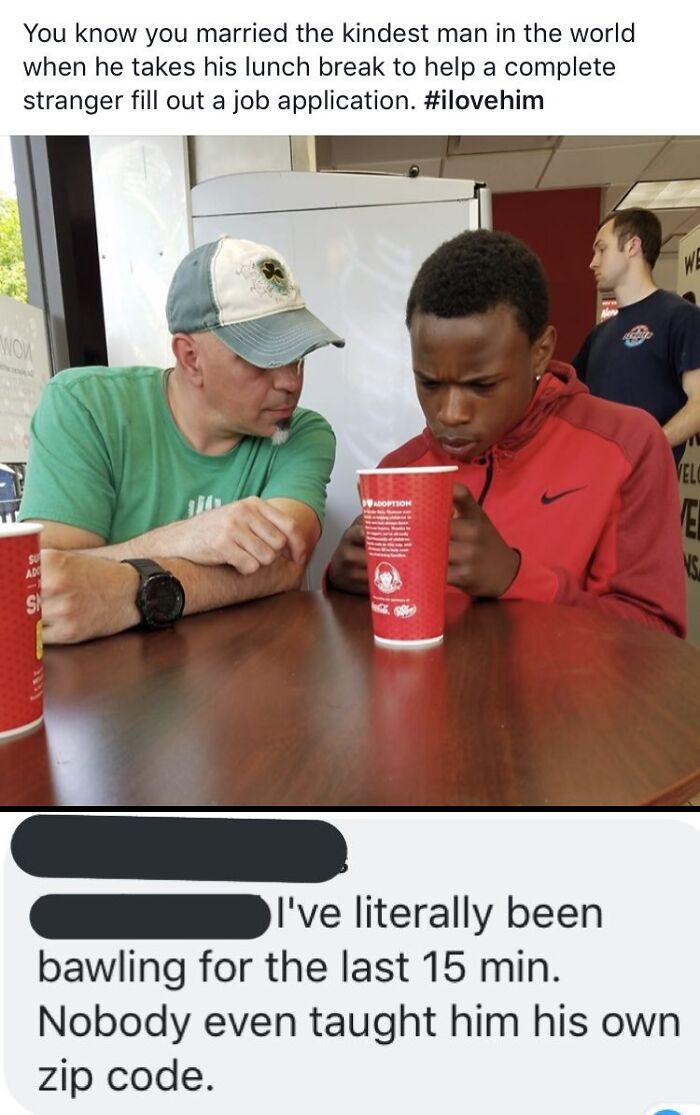 Two men sitting at a table, one helping the other with a job application, an example of amazing fathers.