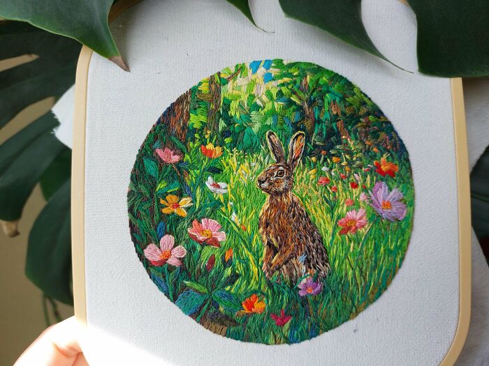 Detailed rabbit in a flower field, beautiful embroidery projects