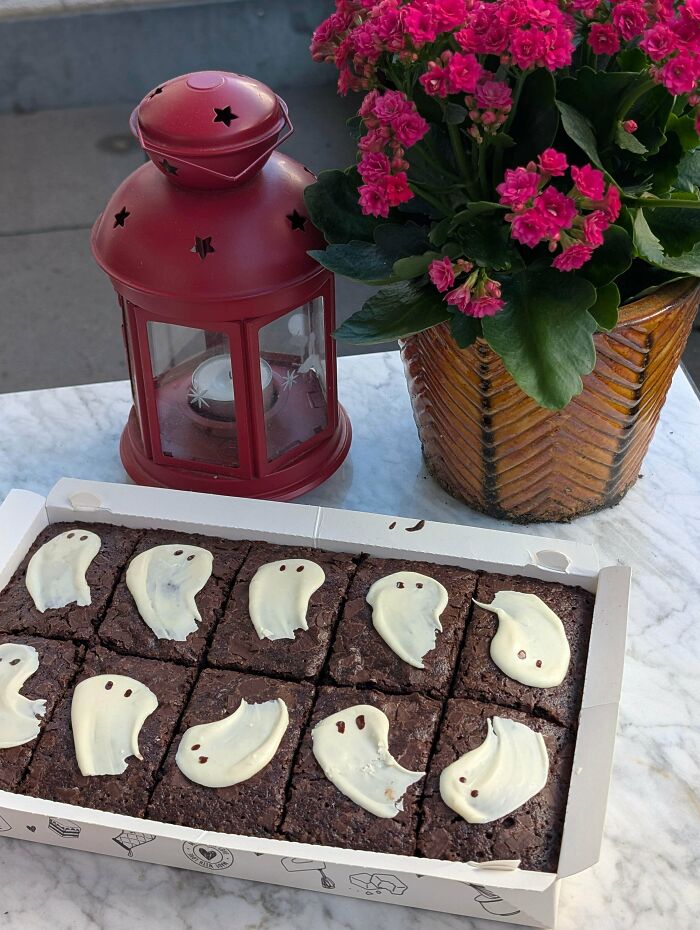 Delicious brownies with ghost-shaped icing, proving bakers can make amazing treats.
