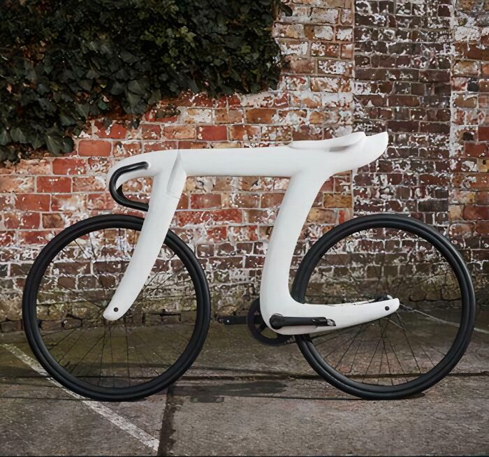 Minimalist futuristic bike design against brick wall showing less is more design concept