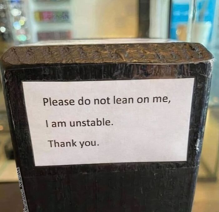 Humorous random meme sign stating it is unstable and not to lean