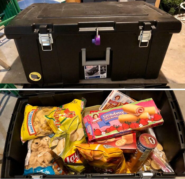 An amazing father gift, a black storage bin filled with various snacks and treats, showing true parents love.
