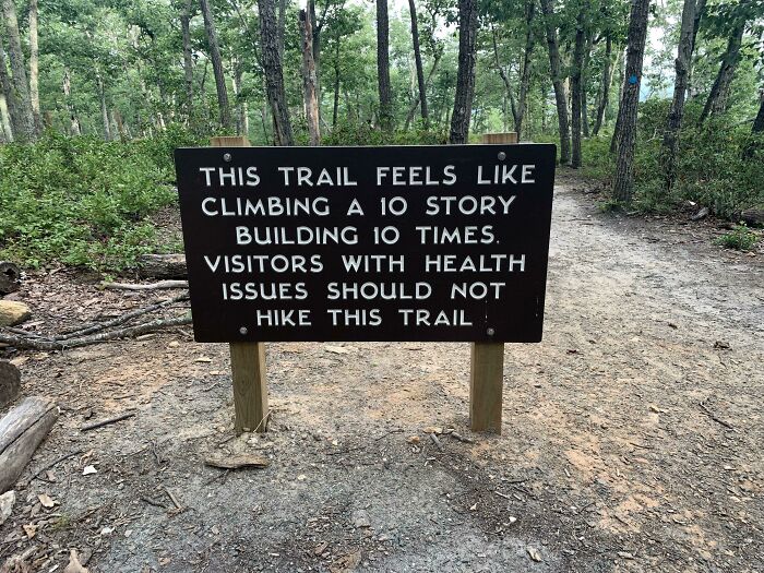 A funny sign advising against hiking a strenuous trail, found in the wild.