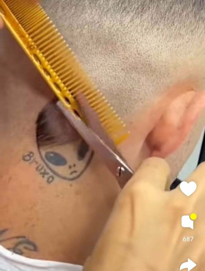Close up of tribal eyebrows and mustache tattoo fails on man's face