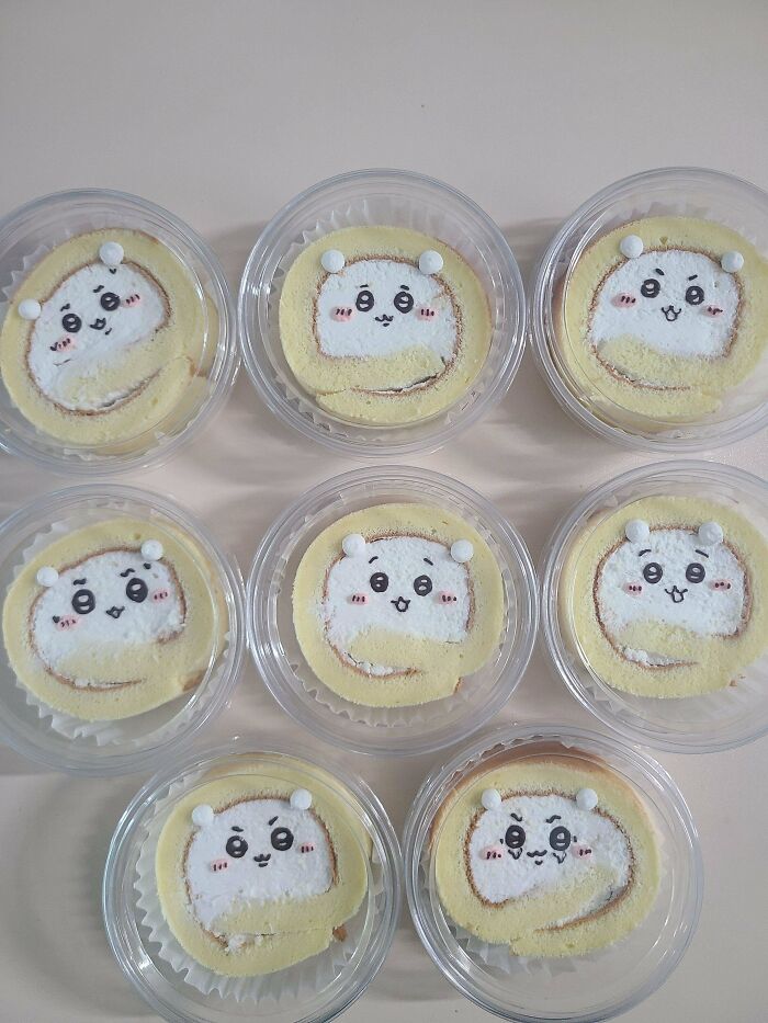 Eight individual swiss roll treats with cute hamster faces, perfect examples of amazing and delicious baking.