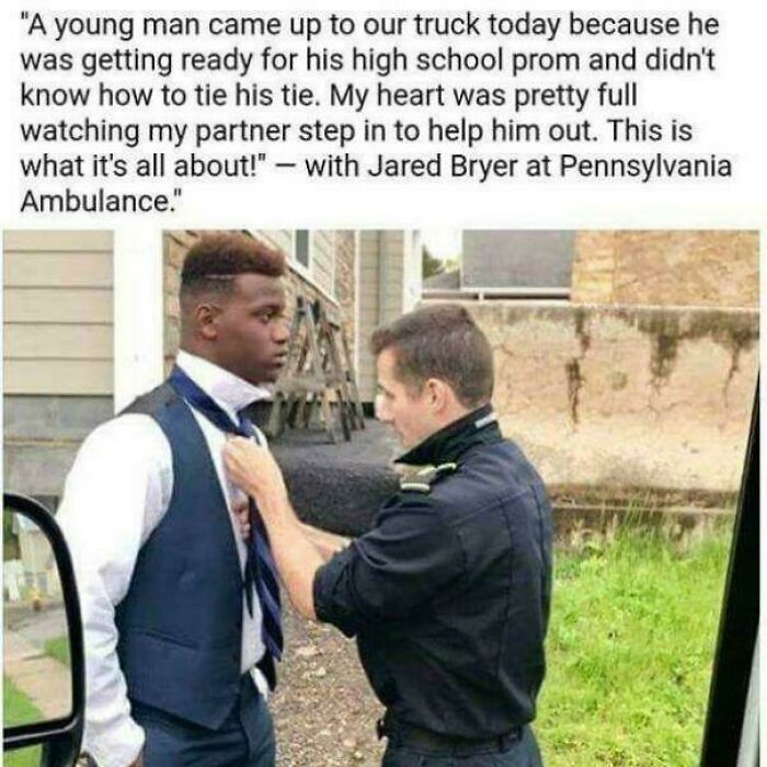 A young man gets help tying his tie from a man showing strength and kindness.