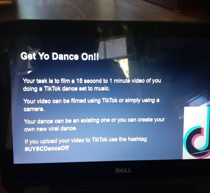 A laptop screen displaying a task to film a TikTok dance video, potentially set by a toxic teacher.