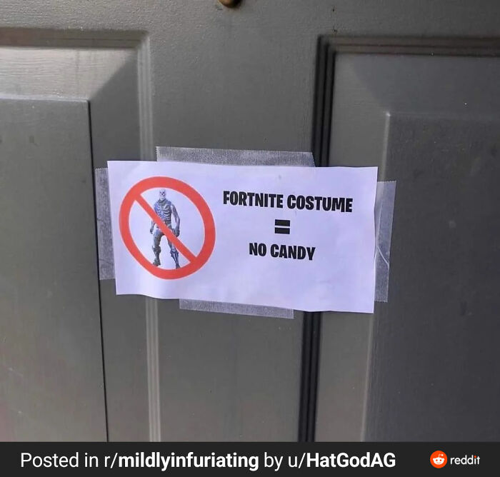 A sign on a door saying Fortnite costume = no candy, a Mad Lad challenging trick-or-treaters.
