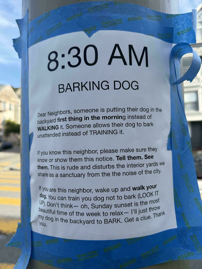 A funny neighbors note taped to a pole, complaining about a barking dog at 8:30 AM.