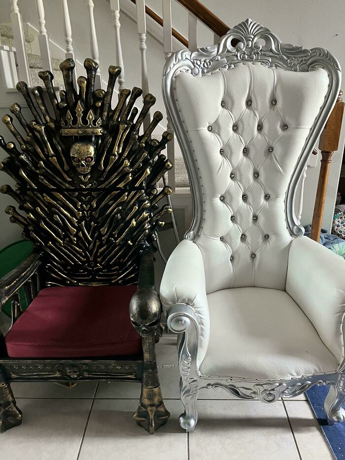 Two ornate chairs, one resembling the Iron Throne, discovered during dumpster diving.