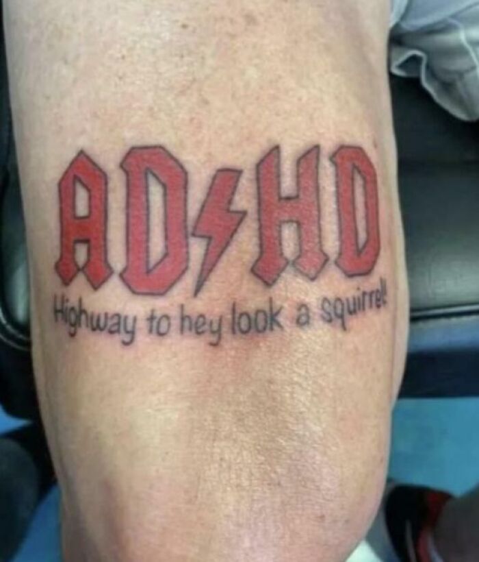 Funny ADHD tattoo with distracted slogan on skin