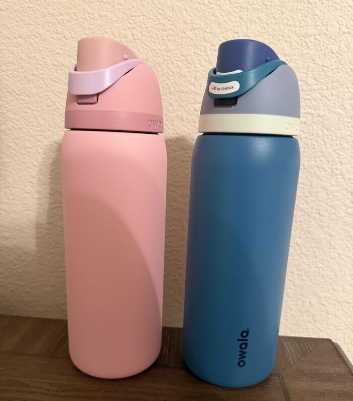 Two Owala water bottles, one pink and one blue, showcasing Prime Day Deals on hydration accessories.