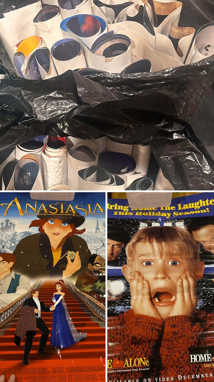 A black trash bag filled with movie posters from dumpster diving, showing Anastasia and Home Alone movie posters.