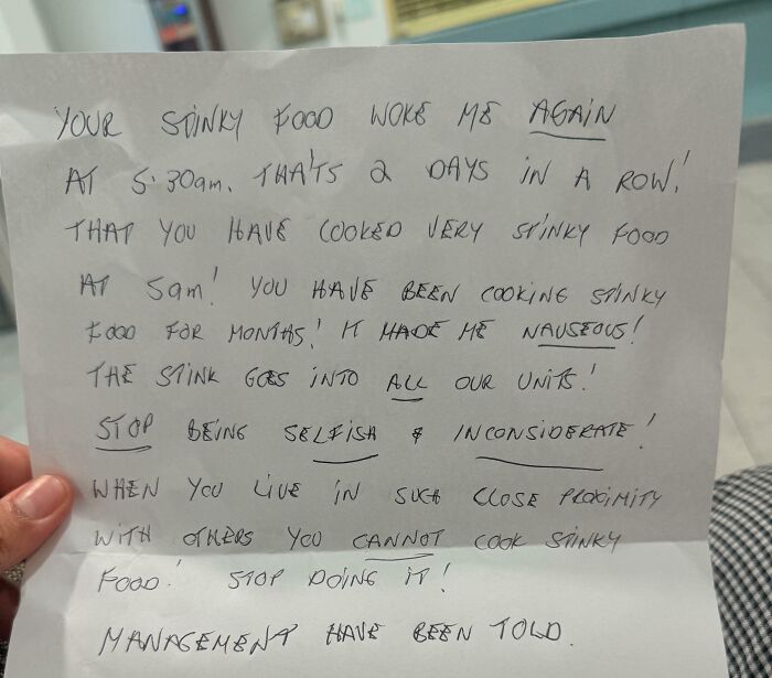 A handwritten note about funny neighbors notes complaining about stinky food that wakes the writer up early.