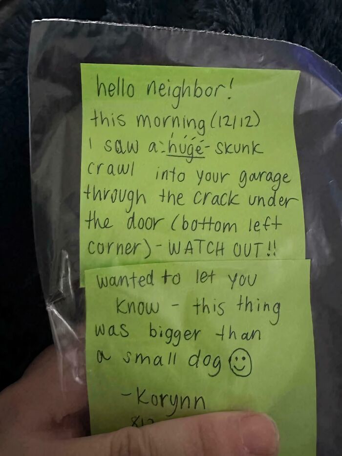 A handwritten note on green paper, a funny neighbors note warning about a huge skunk entering a garage.