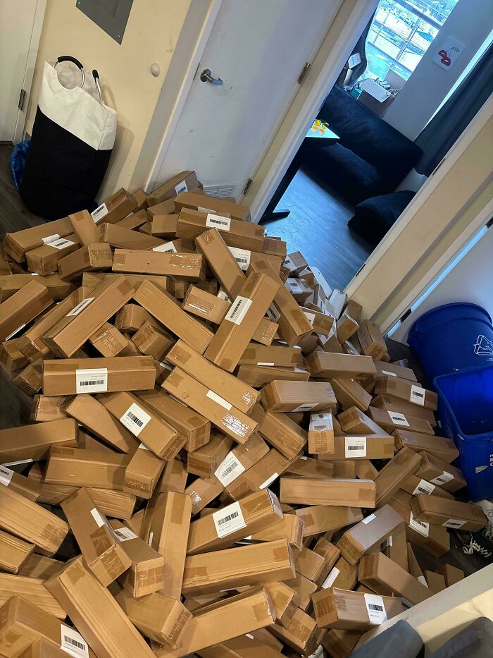 A huge pile of boxes cluttering a hallway, demonstrating how some horrible roommates create messes.