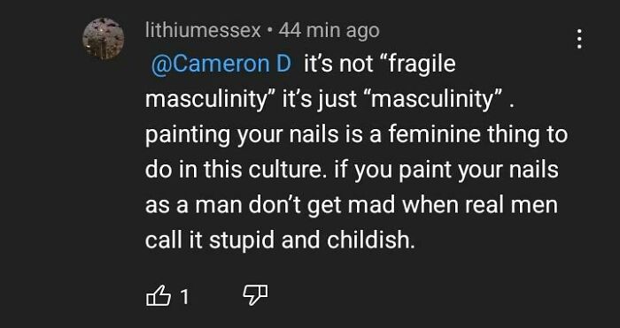 A YouTube comment dismissing fragile masculinity, calling painted nails on men childish and stupid.