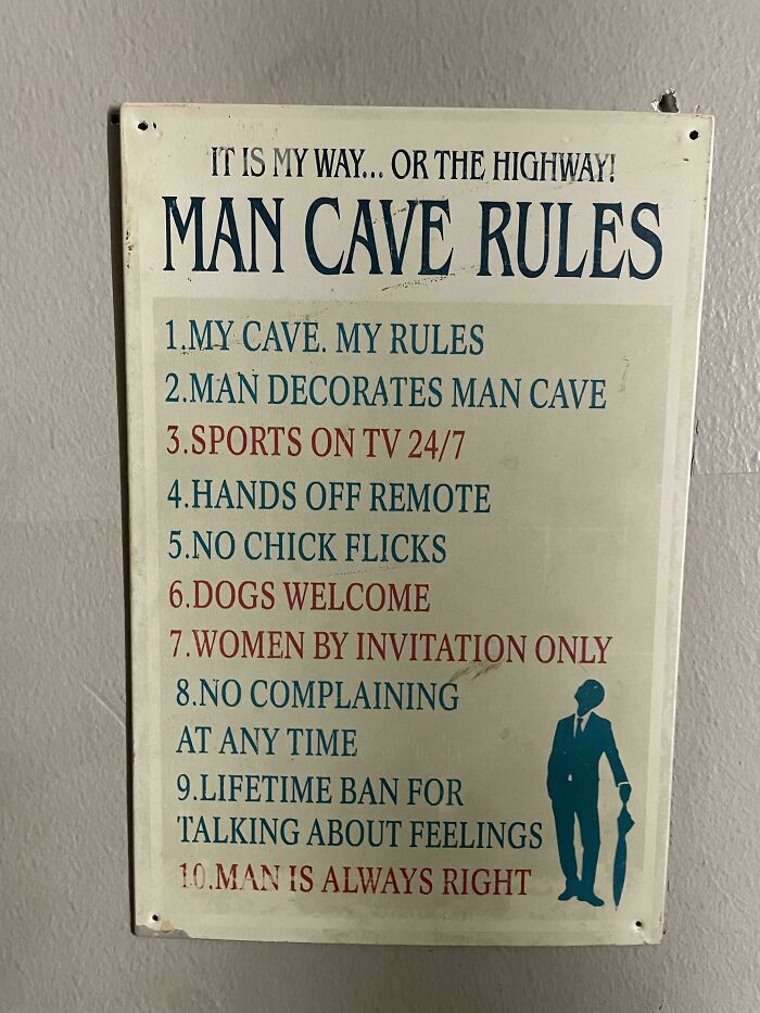 A sign listing humorous man cave rules, reflecting fragile masculinity.
