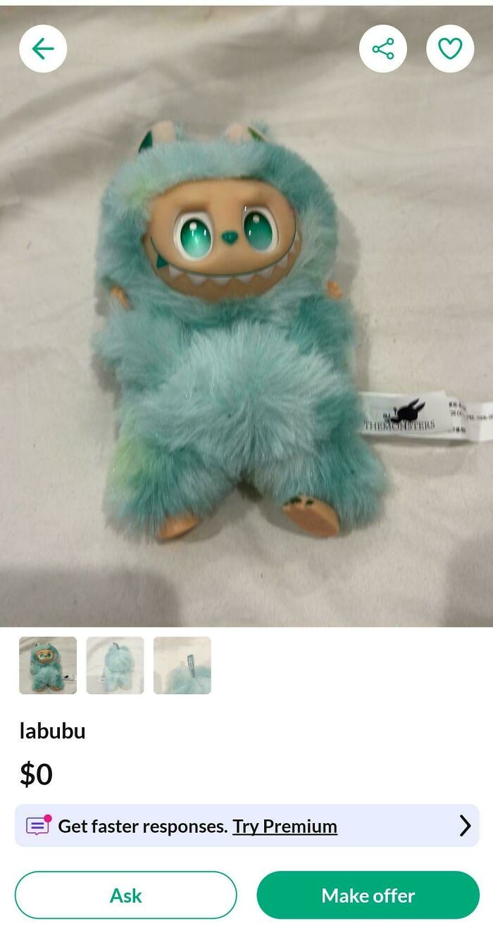 A fluffy, teal Labubu plush doll with big green eyes listed for $0, revealing an insulting consumerism price difference.