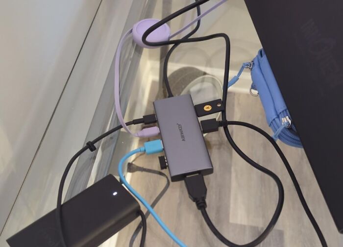 A USB hub with various cables connected, showcasing essential Prime Day Electronics Deals.