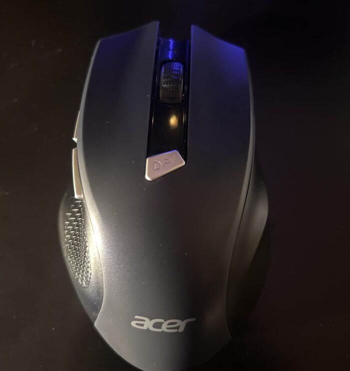 An Acer computer mouse on a dark surface, featuring Prime Day Electronics Deals.