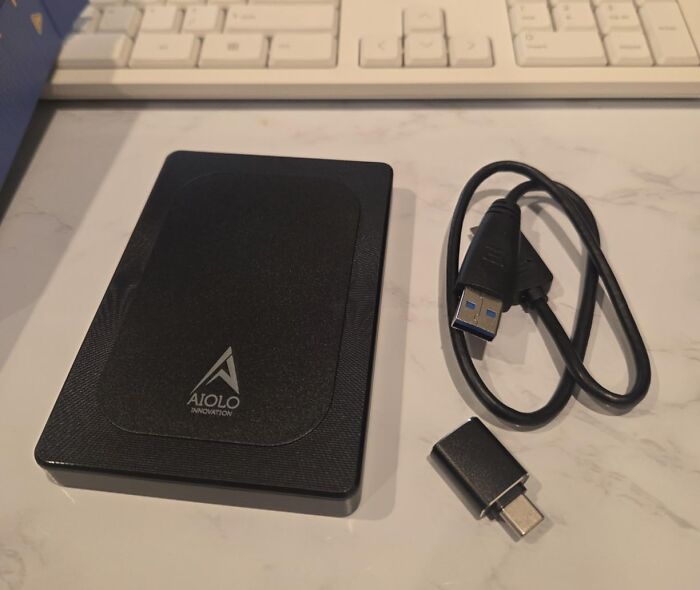 An Aiolo external hard drive with a USB cable and adapter, a useful Prime Day electronics deal.