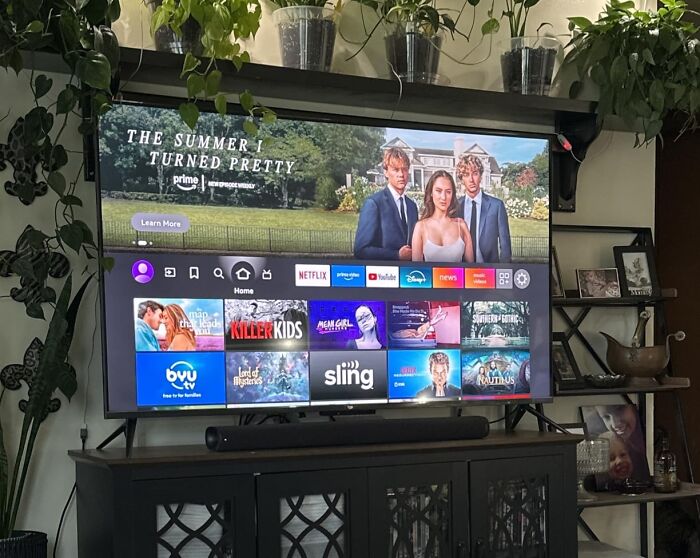 A television displaying streaming apps, showcasing Prime Day electronics deals.