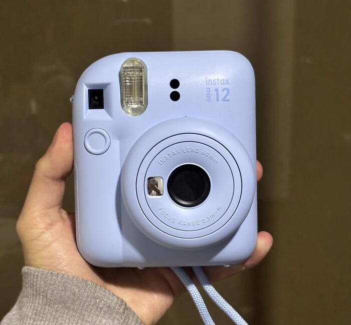 A close-up of a blue Instax Mini 12 camera, one of many Prime Day electronics deals.