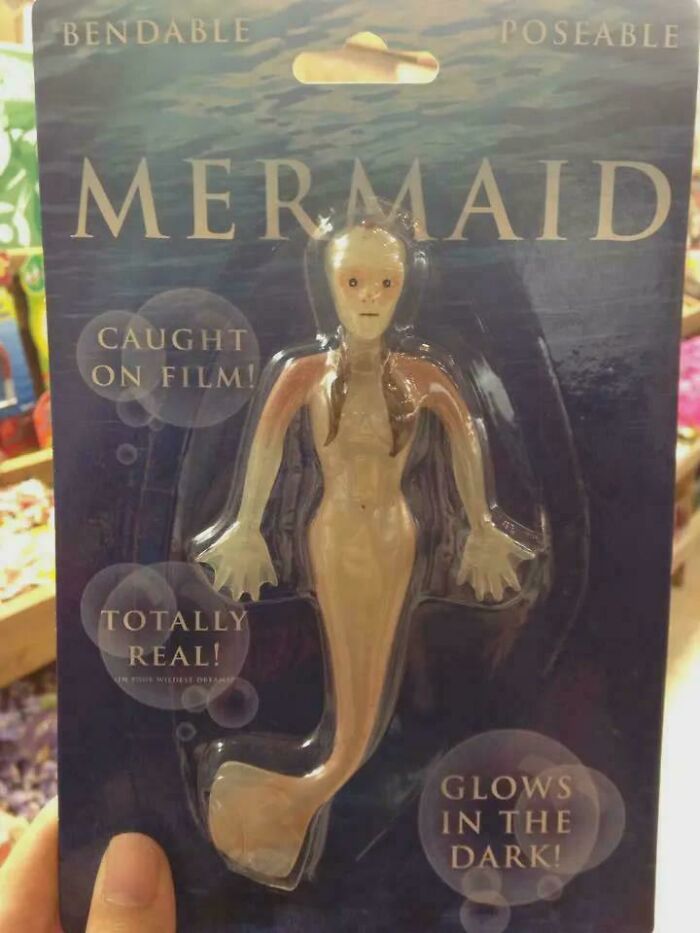 A bendable, poseable mermaid toy, a design fail that makes people feel uncomfortable, packaged as 'totally real' and 'glows in the dark.'