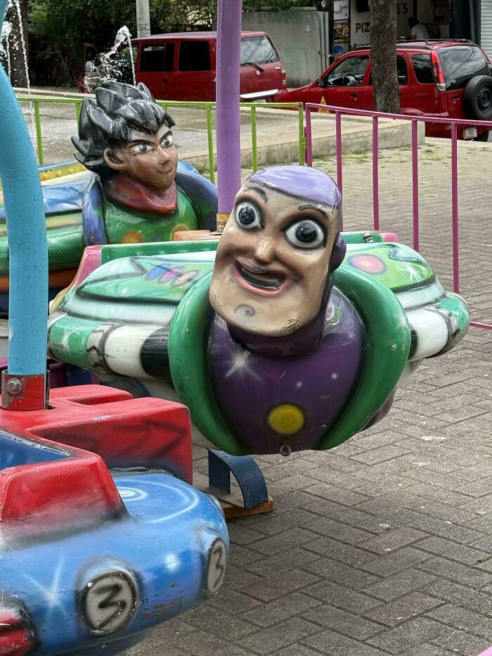Creepy design fails of Buzz Lightyear and anime characters on a fair ride, making people uncomfortable.