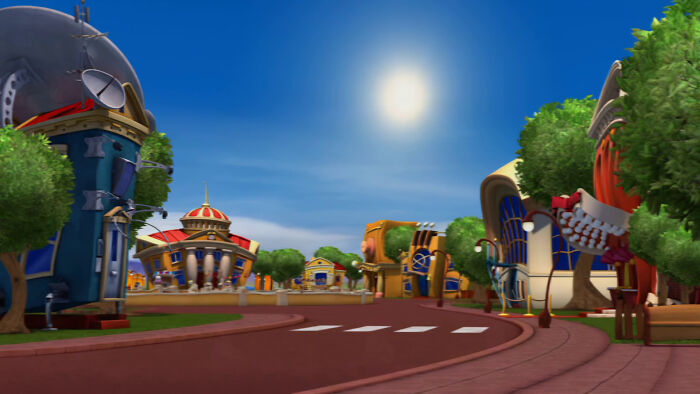 A brightly lit animated town with various cartoon buildings, far from the creepy design fails.