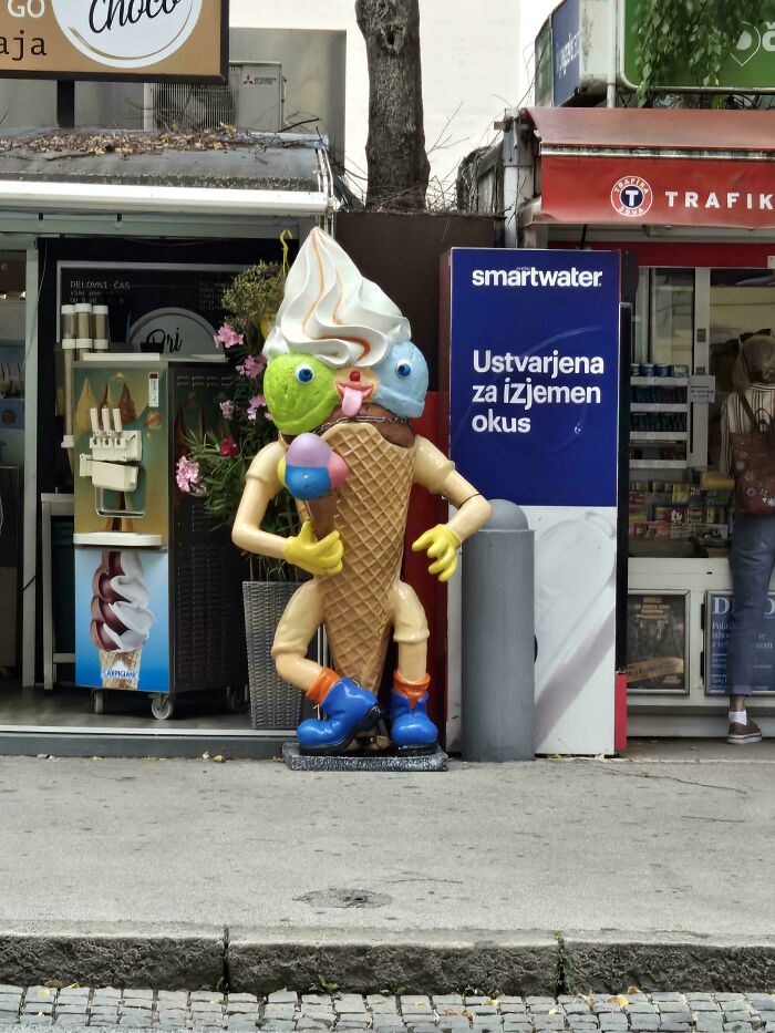 A large ice cream cone statue with a creepy, humanoid design, an uncomfortable design fail.