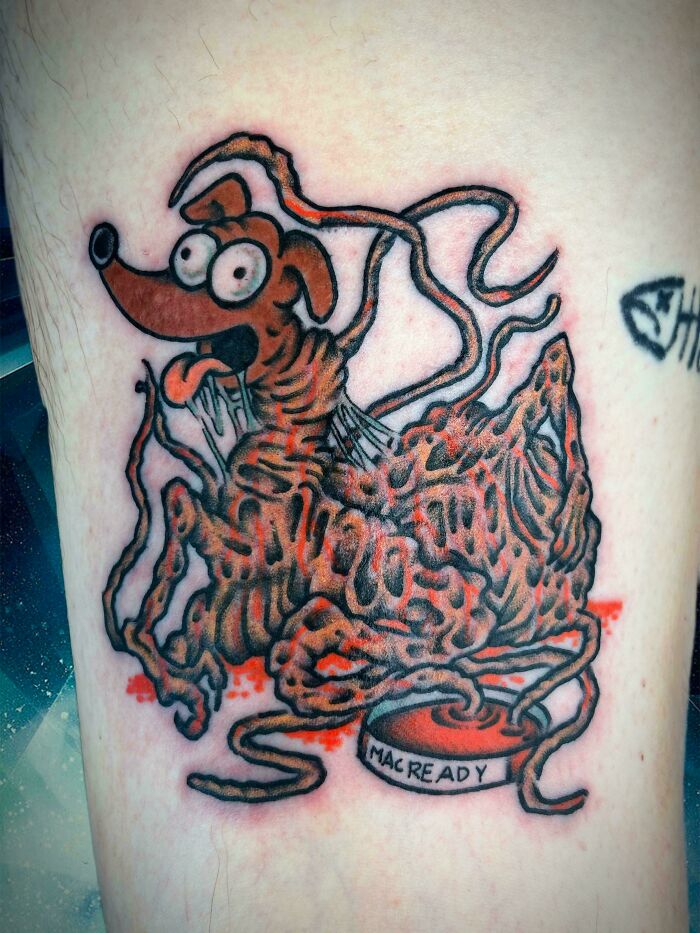 A creepy tattoo of a dog-like creature made of spaghetti and eyeballs, a design fail making people uncomfortable.