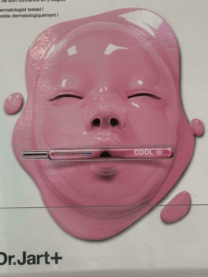Creepy design fail: a pink face mask with closed eyes and a thermometer in the mouth.
