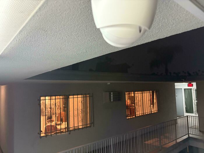 A camera installed by a horrible landlord, making a tenant's life miserable despite a sign prohibiting cameras.