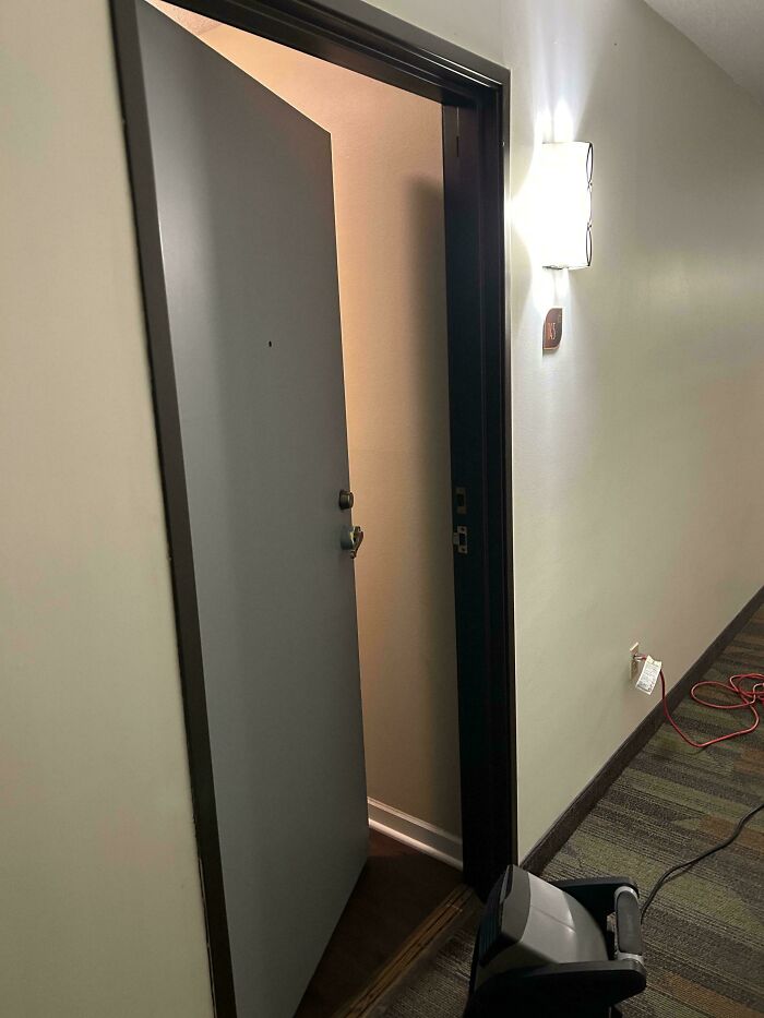 An open apartment door, showcasing a tenant's lack of privacy due to a horrible landlord.