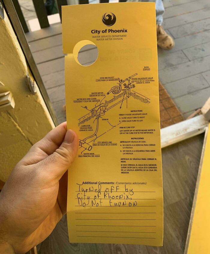 A yellow door hanger from City of Phoenix Water Services, with handwritten notes about water being turned off, showing issues with horrible landlords.