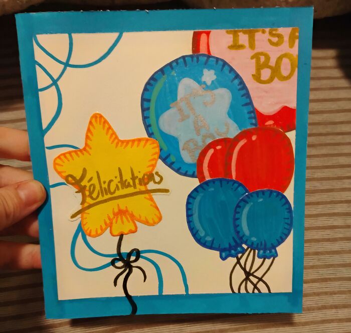 A handmade card with balloons and a star, celebrating a special occasion for a chosen family in adoption stories.