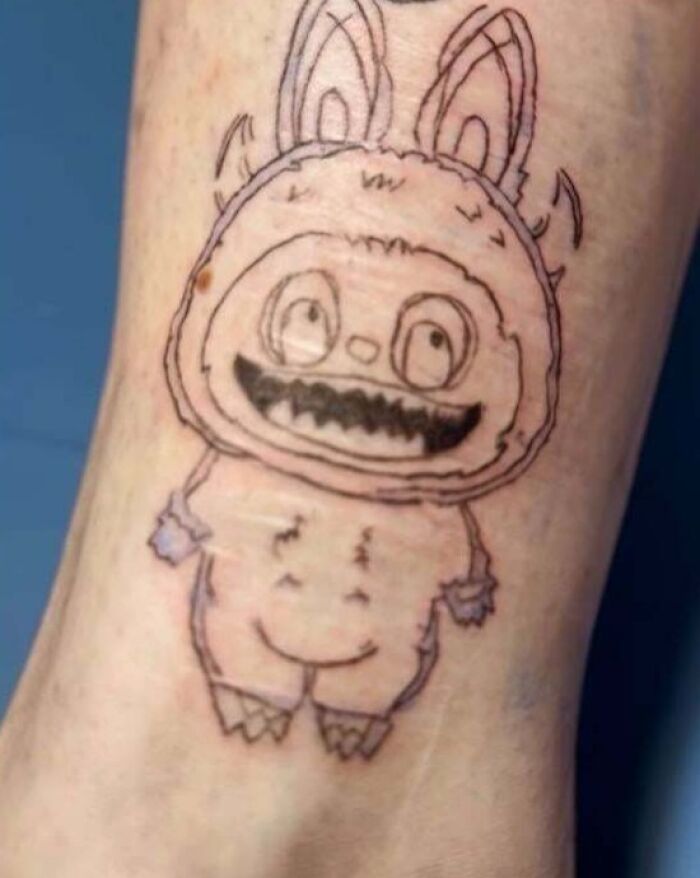 Sketchy bunny character tattoo fail with unclear details