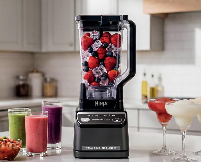 A Ninja Total Crushing Blender filled with strawberries, blueberries, and ice, a top kitchen find on Prime Day.